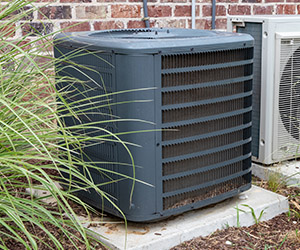 Clean around the outdoor HVAC unit